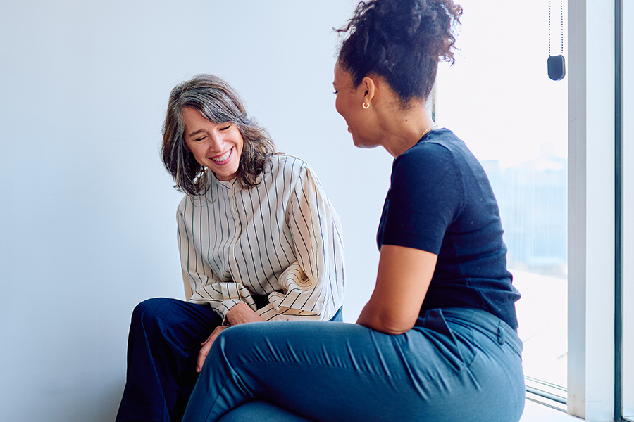 Two business women talking